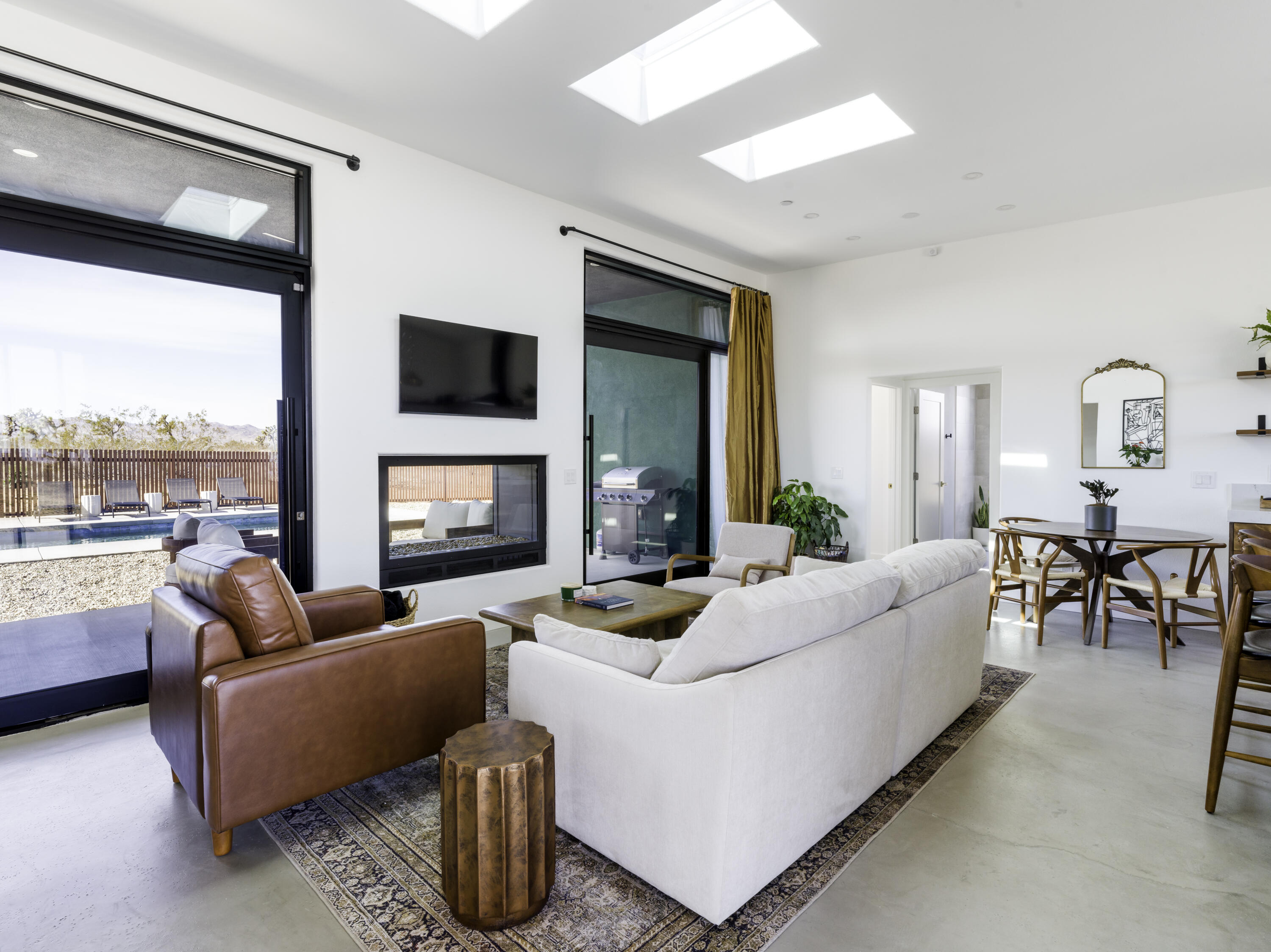 59130 Reche Road Landers, CA 92285 - Photo 4 of 71 a living room with furniture fireplace and a large window