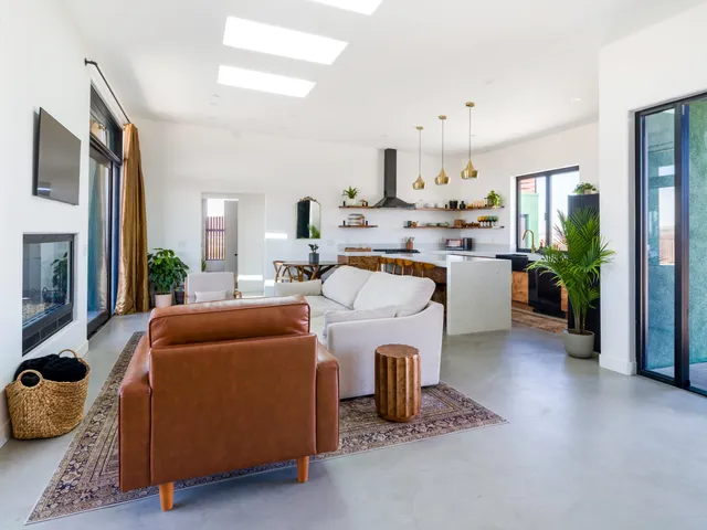 a room with a table and a potted plant