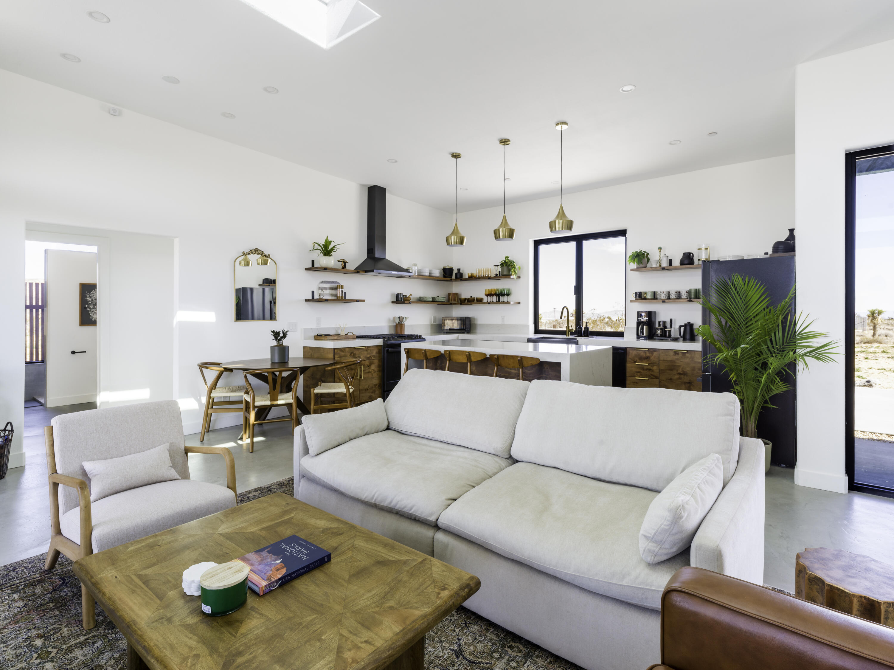 59130 Reche Road Landers, CA 92285 - Photo 7 of 71 a living room with furniture kitchen view and a chandelier