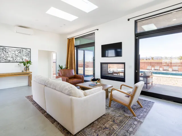 a room with dining table and chairs