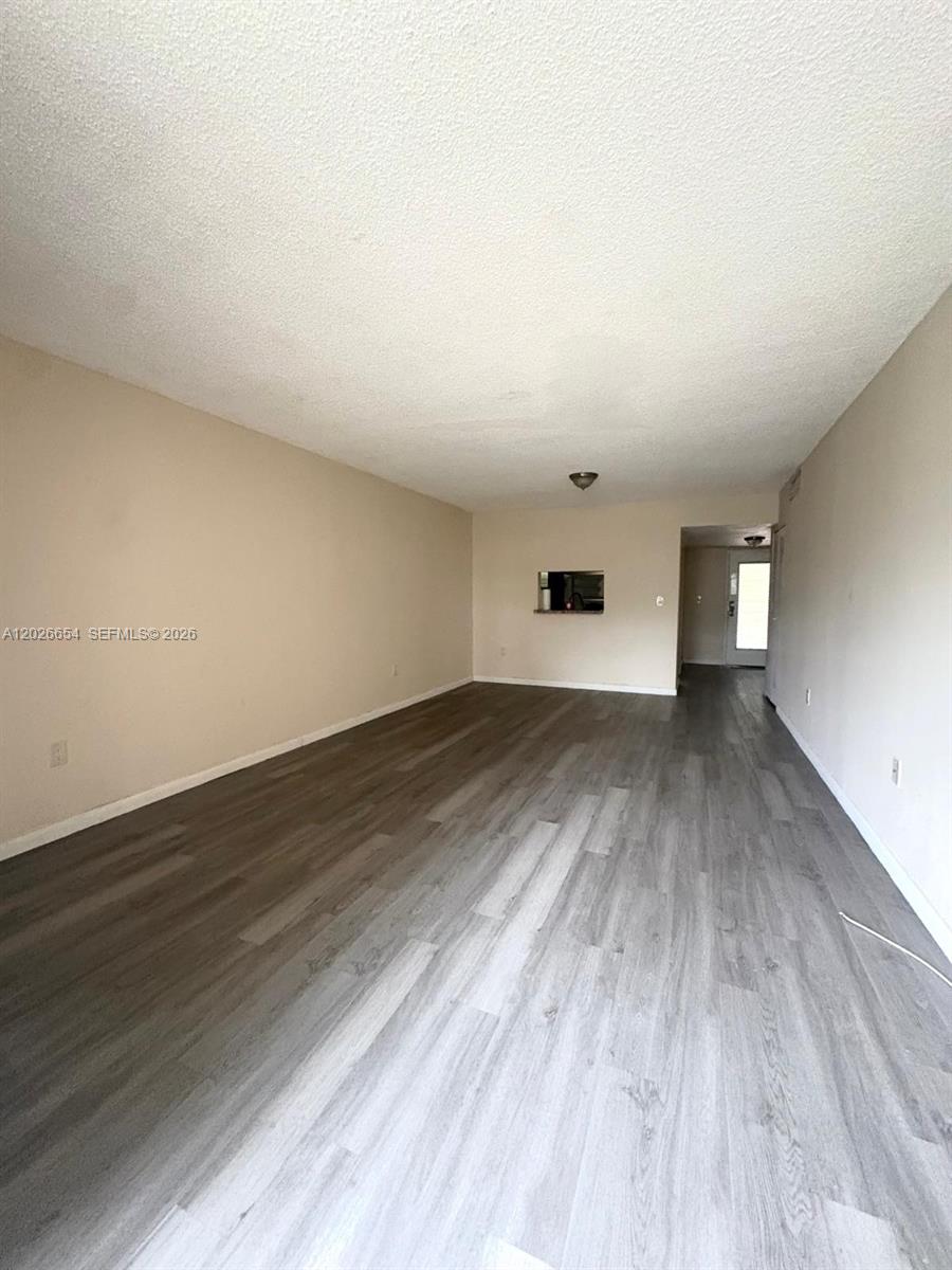 4174 Inverrary Drive, Unit 903 Lauderhill, FL 33319 - Photo 28 of 36 a view of empty room with wooden floor