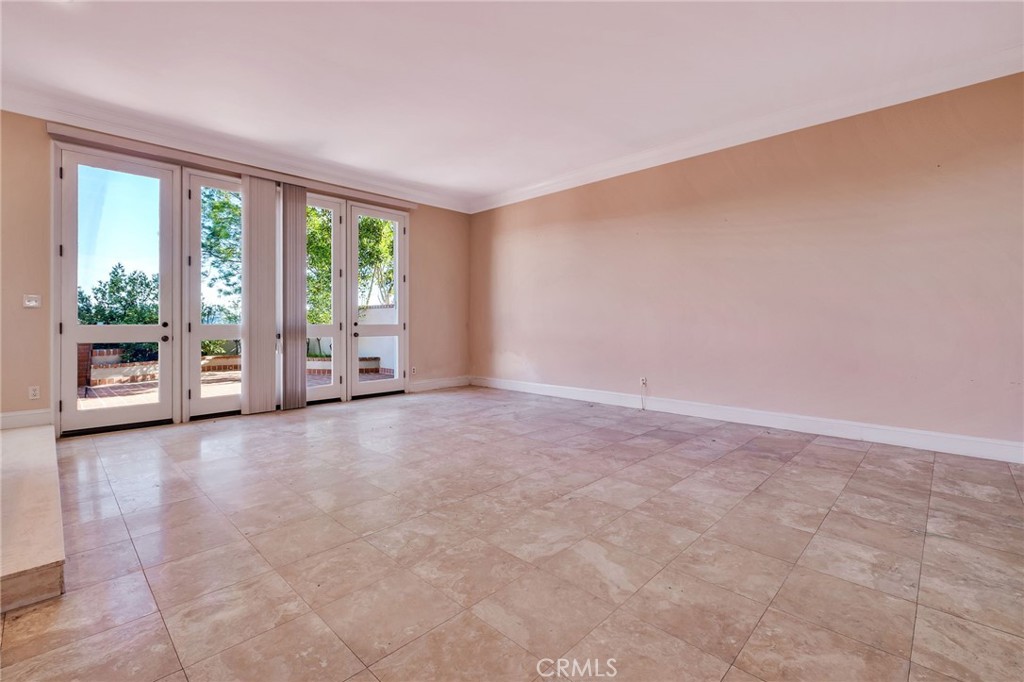 12305 Ridge Circle Los Angeles, CA 90049 - Photo 21 of 59 Living Room with fire place and Wet Bar