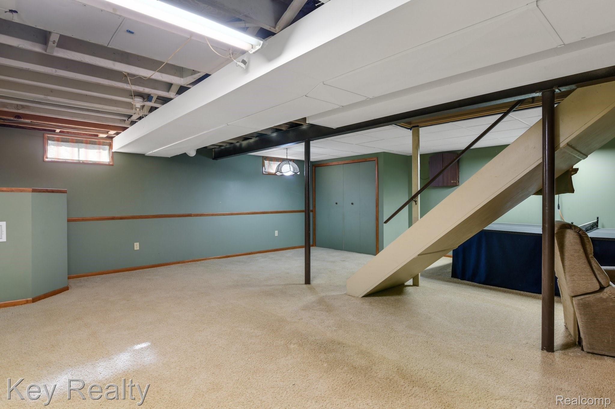 6231 Kings Shire Road Grand Blanc, MI 48439 - Photo 33 of 39 Partially finished basement is perfect for entertaining!