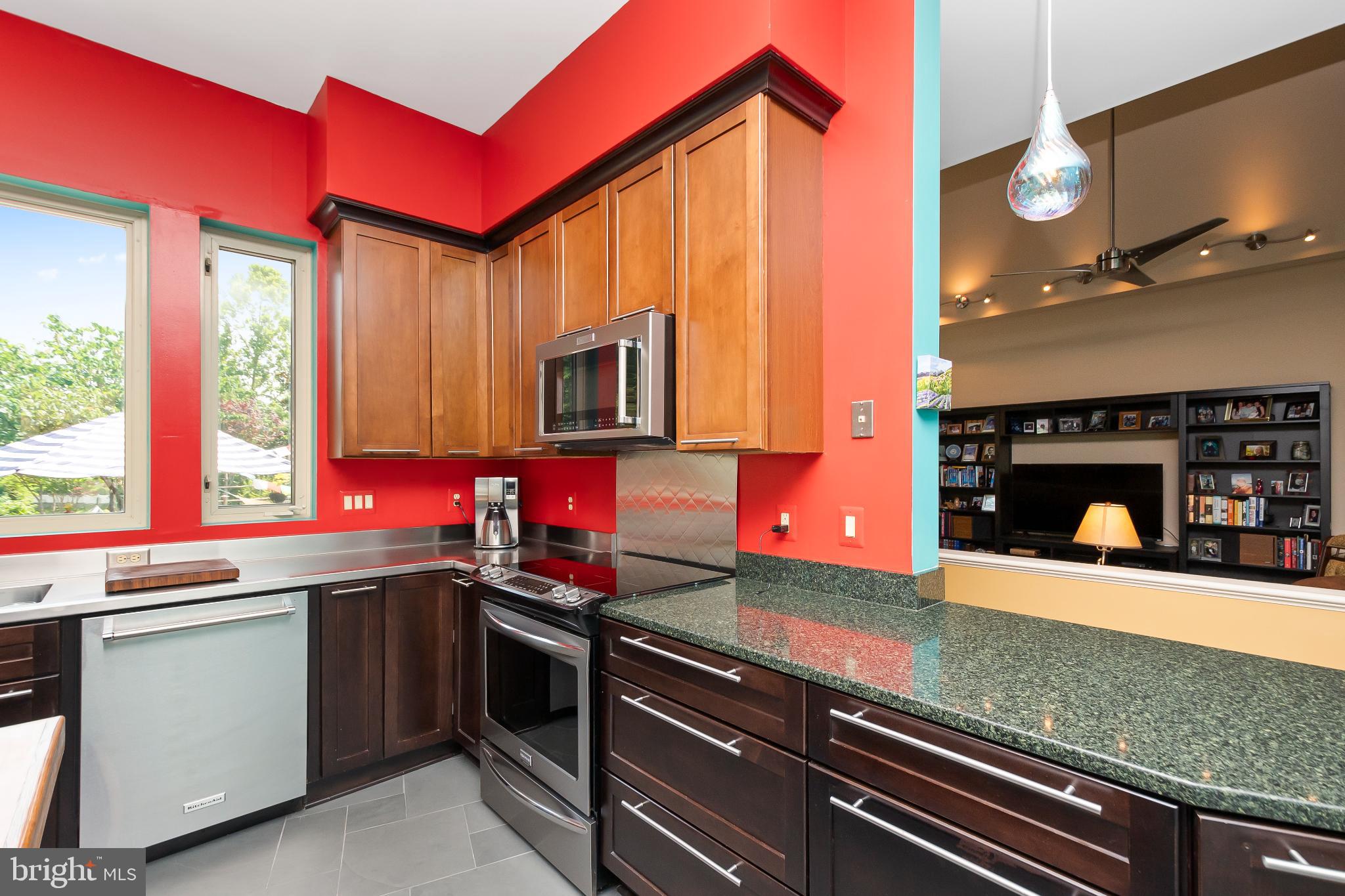 9211 Ox Road Lorton, VA 22079 - Photo 11 of 44 a kitchen with stainless steel appliances a sink stove and cabinets