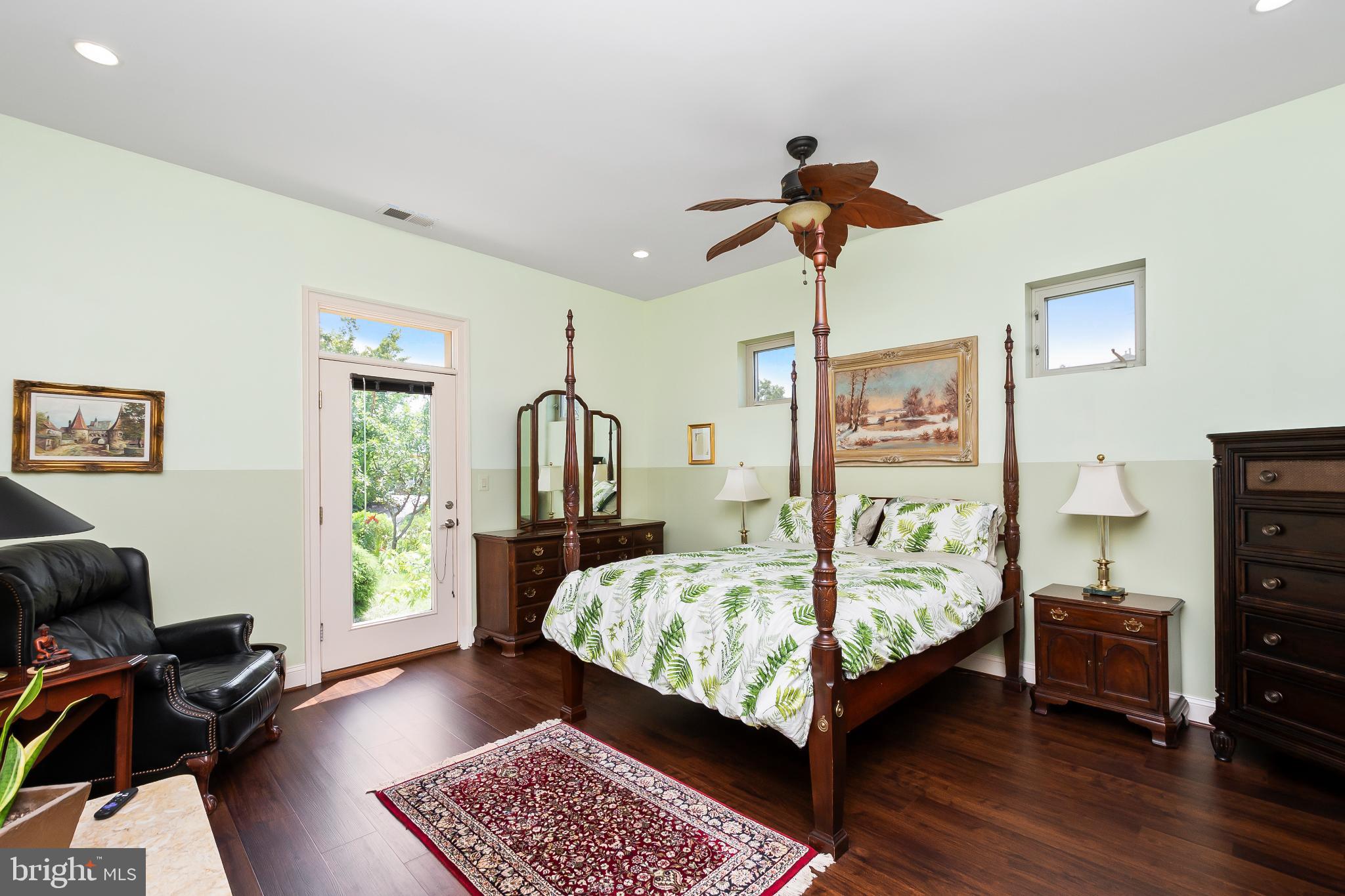 9211 Ox Road Lorton, VA 22079 - Photo 14 of 44 a bedroom with bed and a chandelier