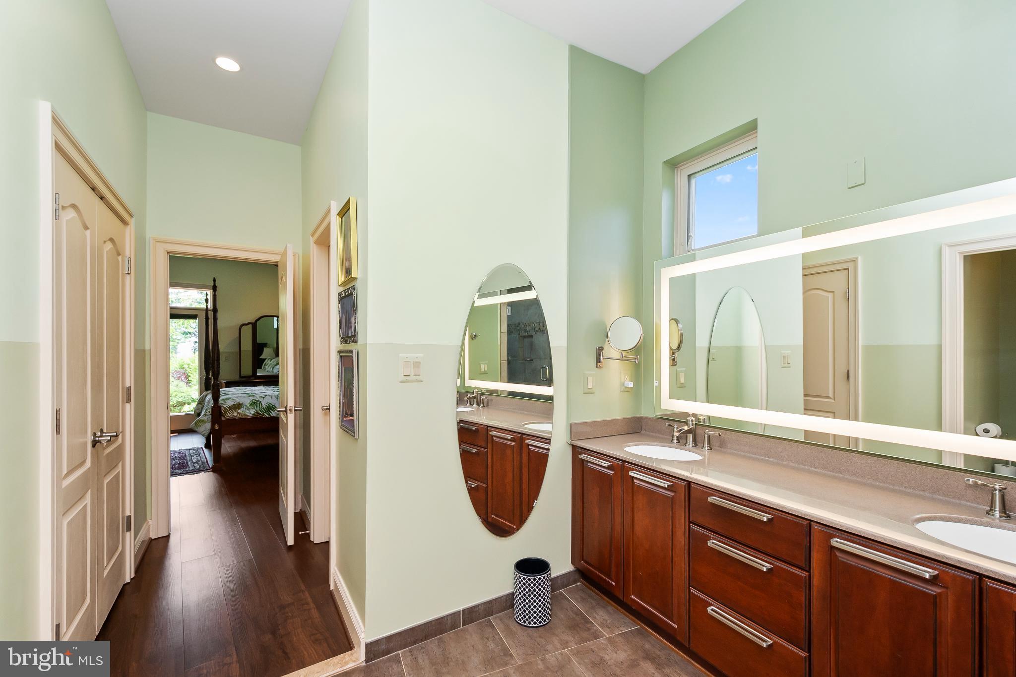 9211 Ox Road Lorton, VA 22079 - Photo 16 of 44 a bathroom with a sink a mirror and a toilet
