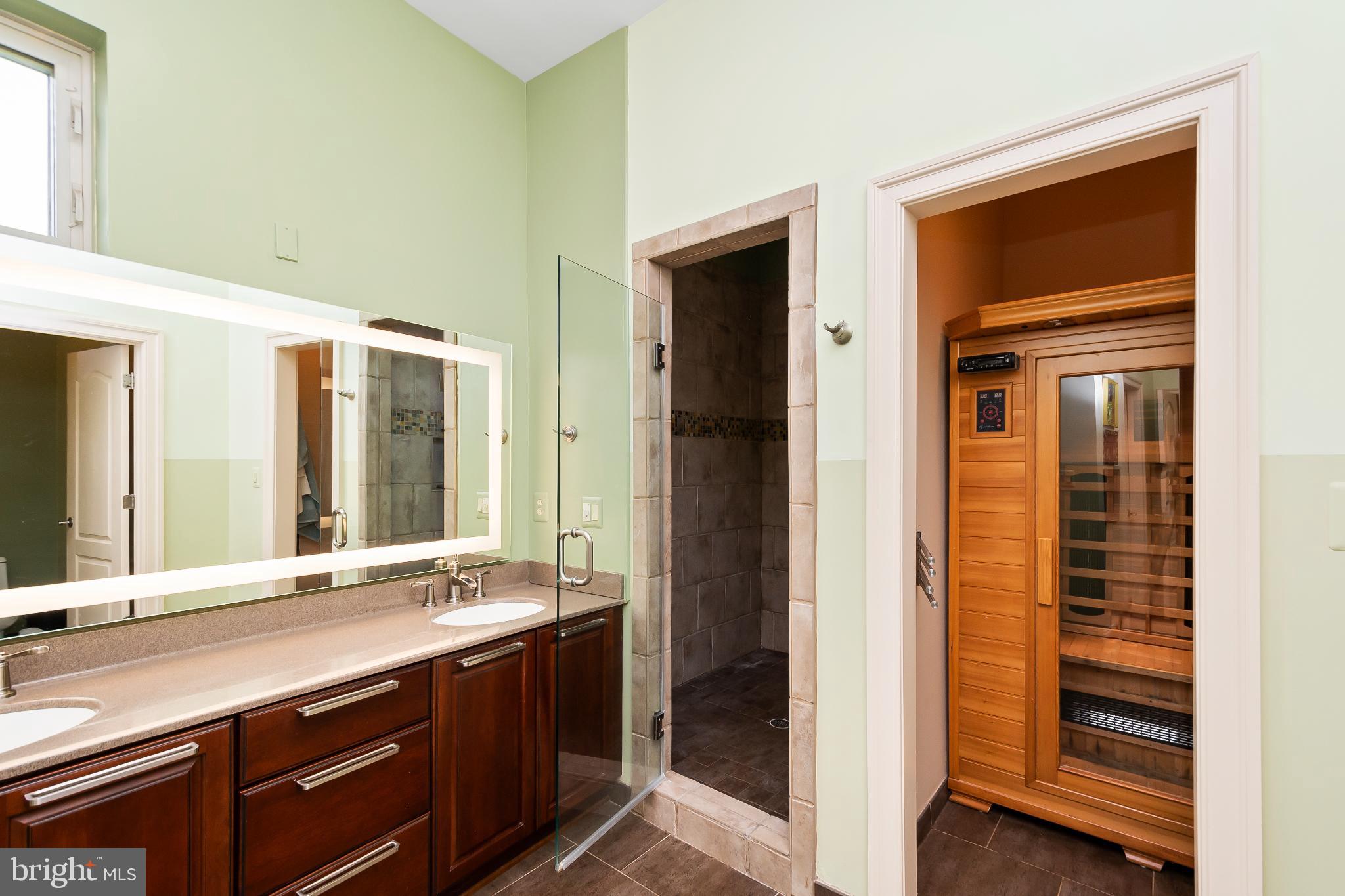 9211 Ox Road Lorton, VA 22079 - Photo 17 of 44 a bathroom with a double vanity sink and a mirror