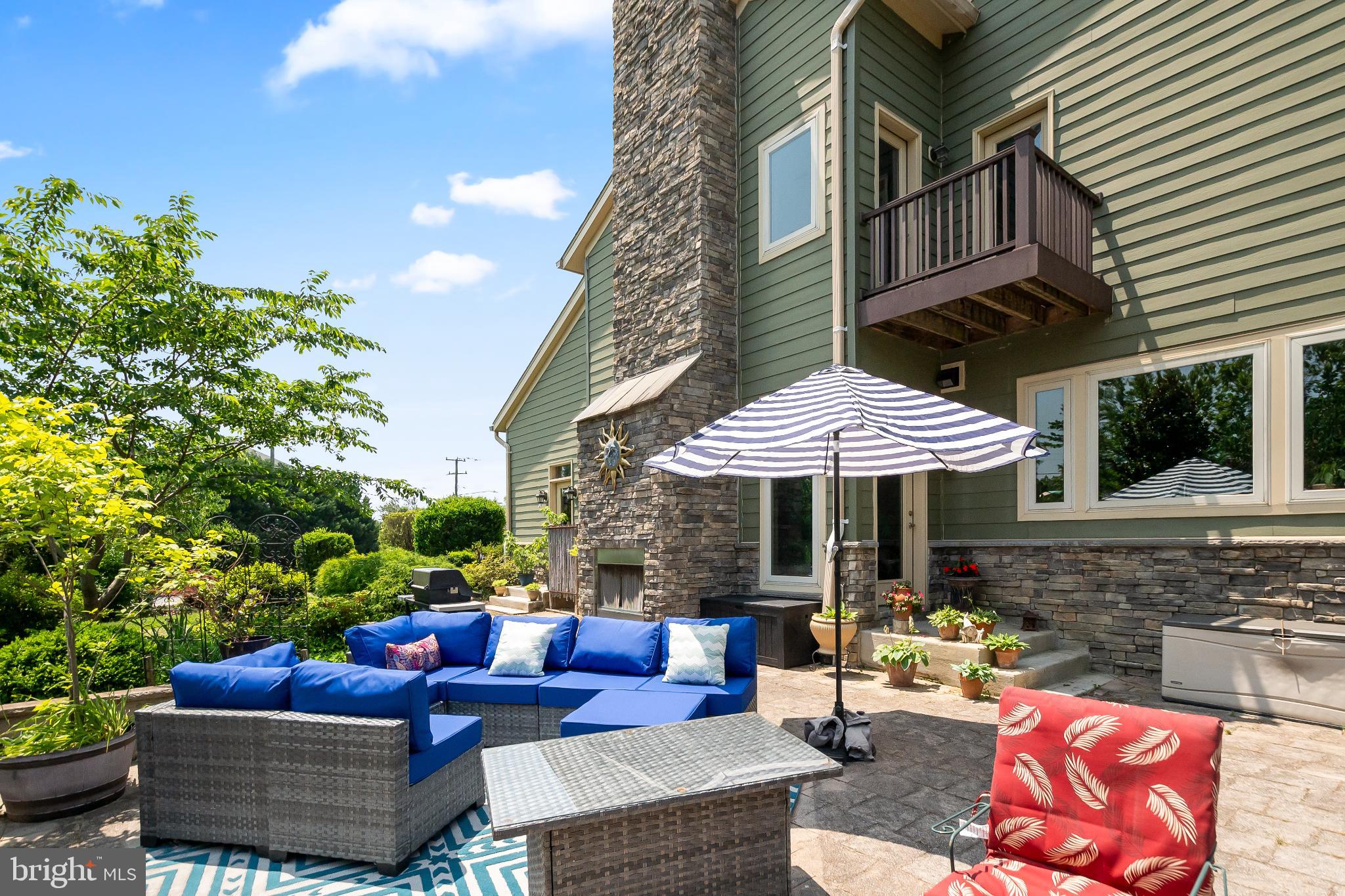 9211 Ox Road Lorton, VA 22079 - Photo 36 of 44 a view of a patio with couches table and chairs and potted plants
