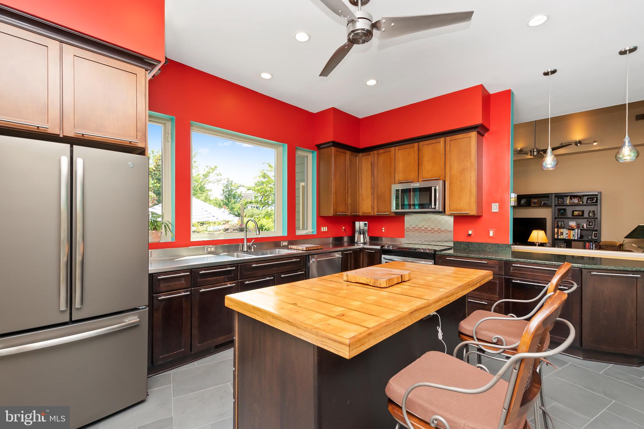 9211 Ox Road Lorton, VA 22079 - Photo 8 of 44 a kitchen with a stove a refrigerator and a dining table