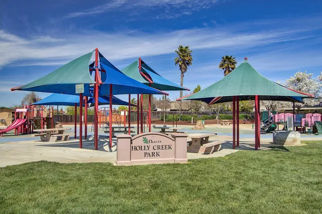 a view of swimming pool is middle in the garden