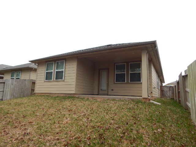 7103 Silverleaf Oak Street Conroe, TX 77304 - Photo 19 of 20 a house with yard