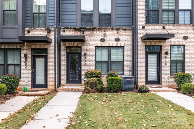 a view of a building with potted plants