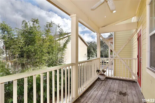 a view of a porch with wooden floor and outdoor space