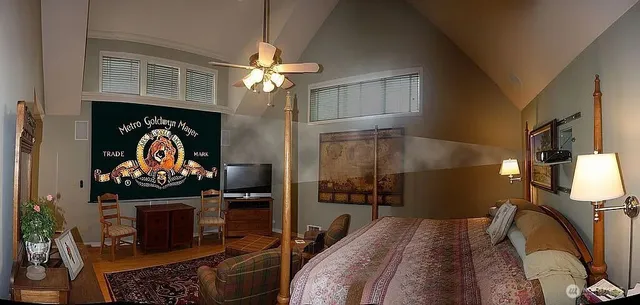 a bedroom with a bed dresser and a window