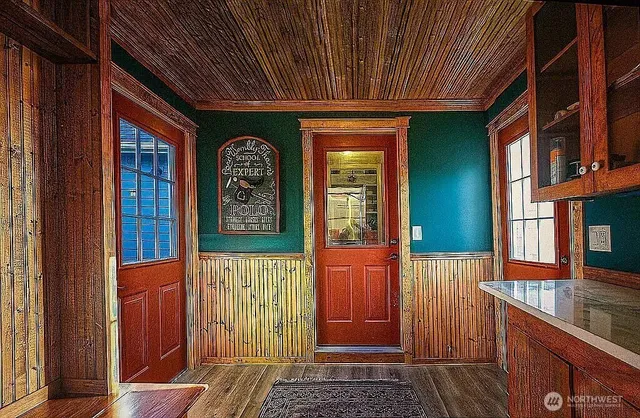 a front view of a house with large windows