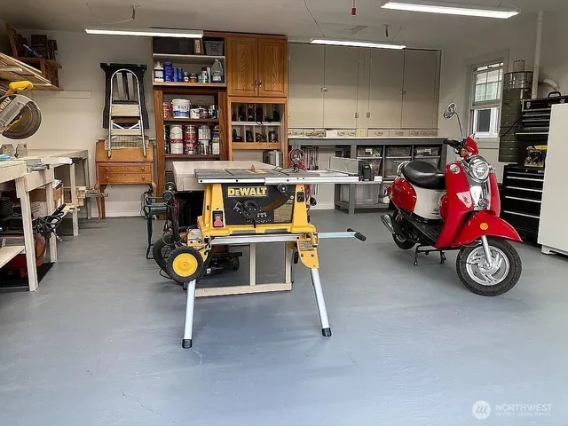 a view of a terrace with chairs and potted plants