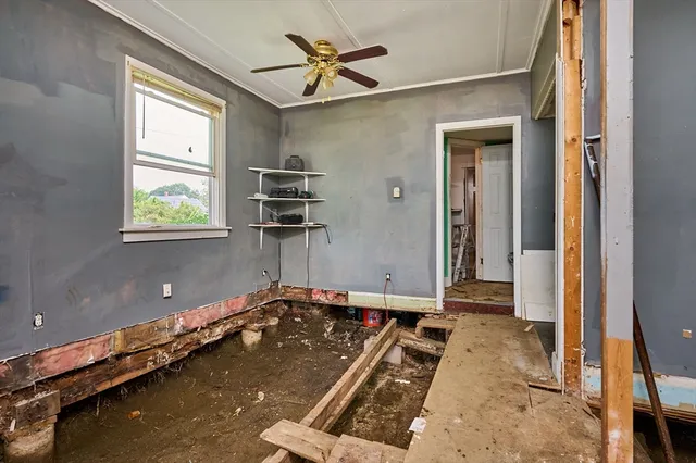 an aerial view of a house with a garden and swimming pool