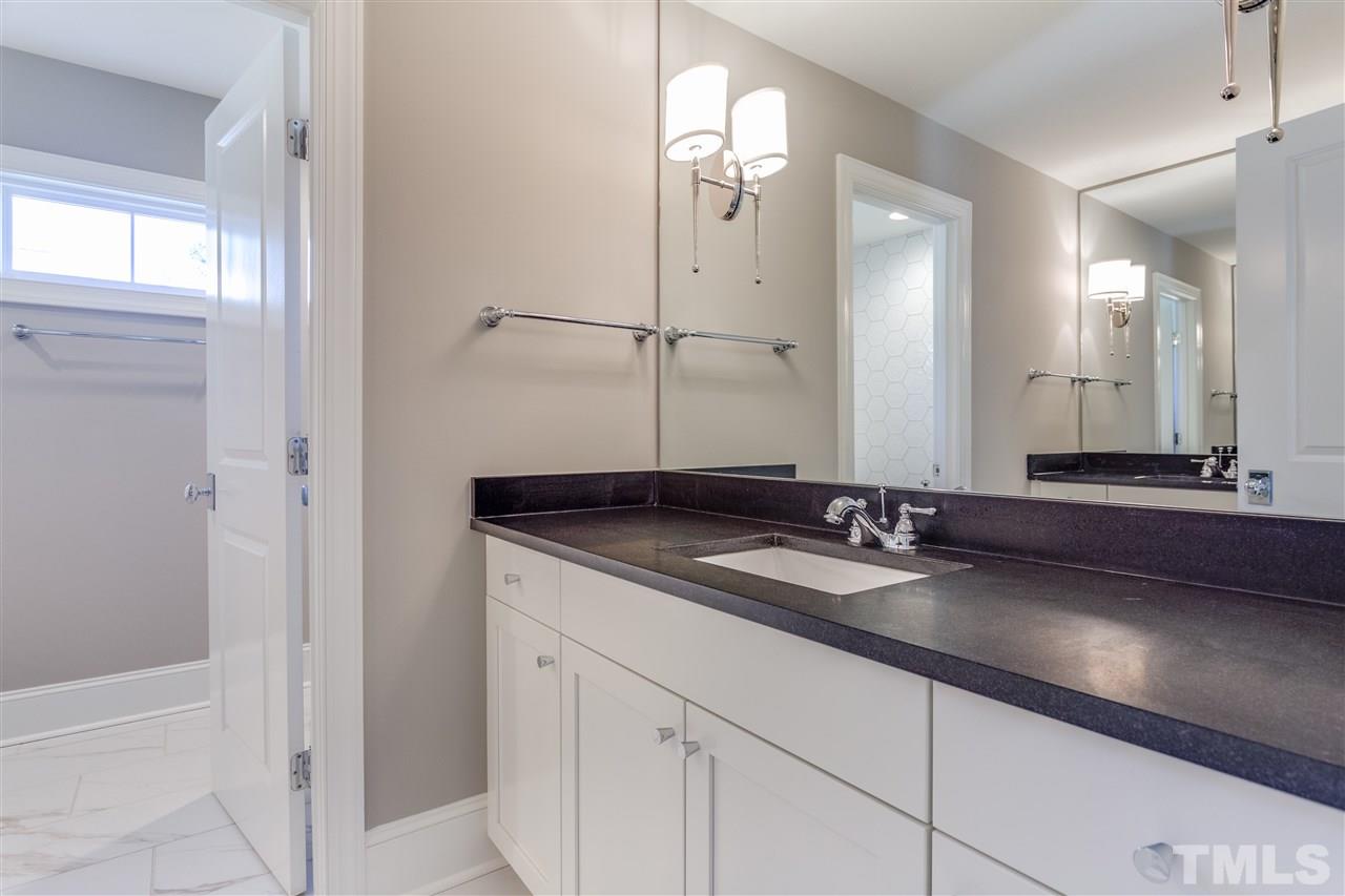 1307 Filmore Street Raleigh, NC 27605 - Photo 16 of 24 Upstairs Bath with dual vanities and gorgeous tile work