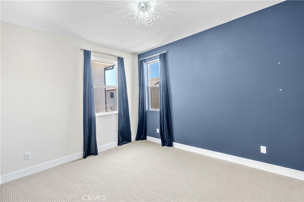 156 Chorus Irvine, CA 92618 - Photo 13 of 45 a view of an empty room with chandelier fan