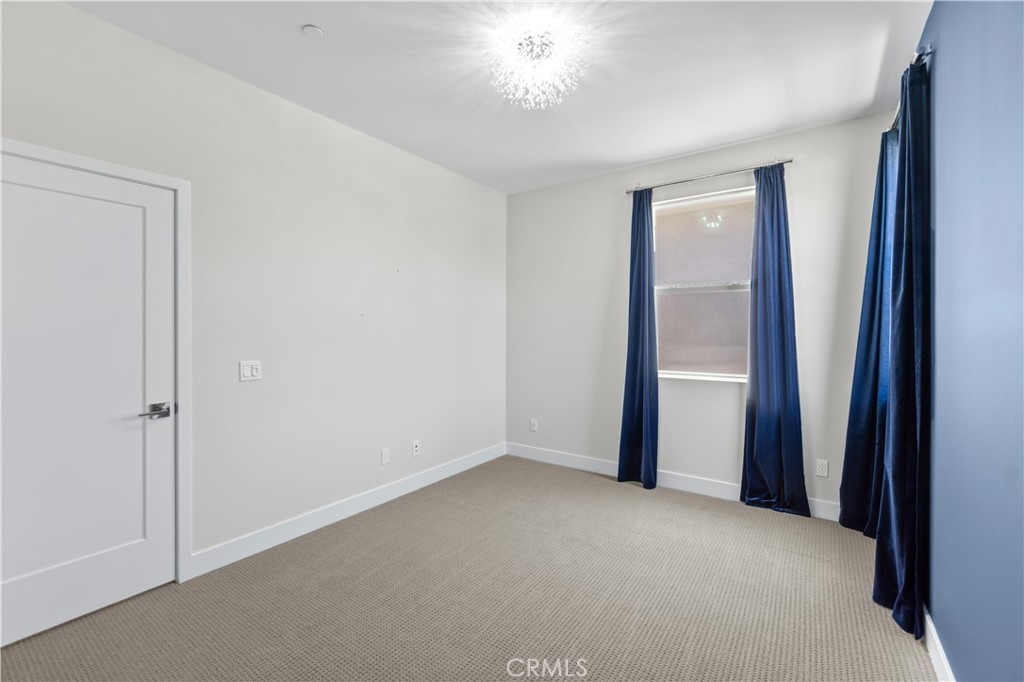 156 Chorus Irvine, CA 92618 - Photo 15 of 45 an empty room with closet and a hallway