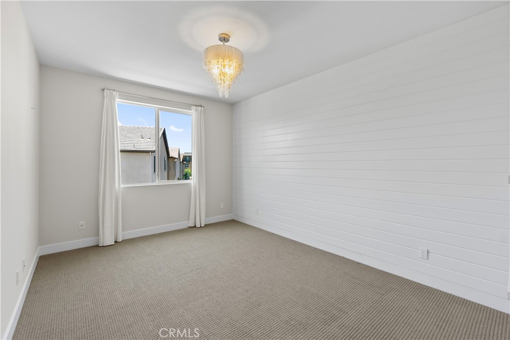 156 Chorus Irvine, CA 92618 - Photo 16 of 45 a view of empty room with wooden floor and fan