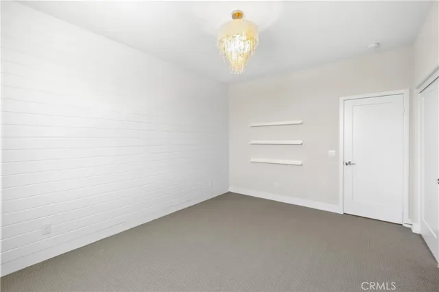 an empty room with a chandelier