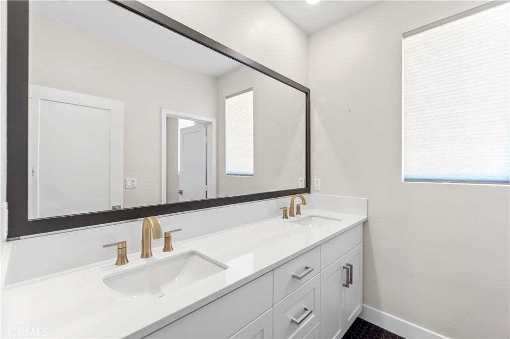 156 Chorus Irvine, CA 92618 - Photo 18 of 45 a bathroom with a sink and a mirror