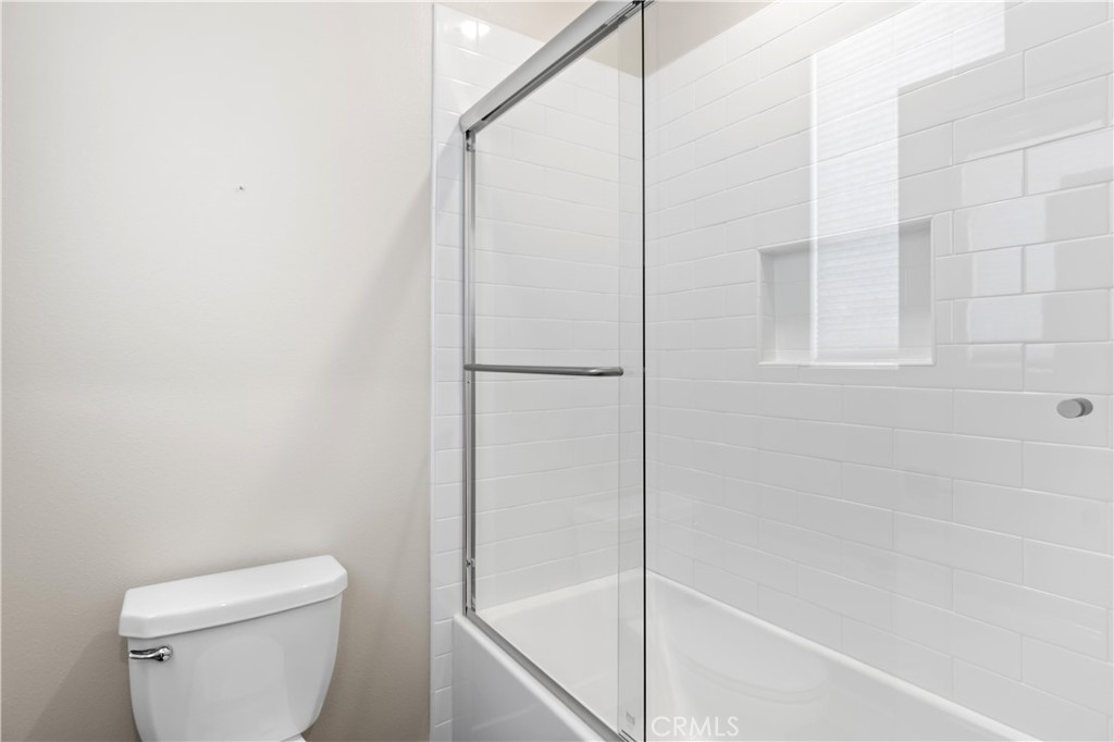 156 Chorus Irvine, CA 92618 - Photo 19 of 45 a bathroom with a shower and a toilet