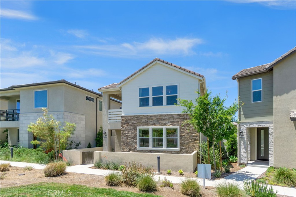 156 Chorus Irvine, CA 92618 - Photo 2 of 45 a front view of a house with a yard