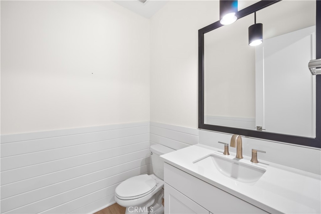 156 Chorus Irvine, CA 92618 - Photo 29 of 45 a bathroom with a sink a toilet and mirror