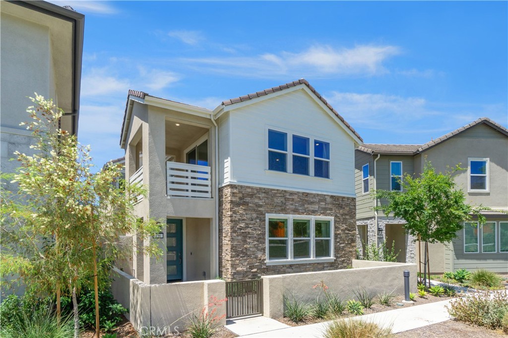 156 Chorus Irvine, CA 92618 - Photo 3 of 45 a front view of a house with plants
