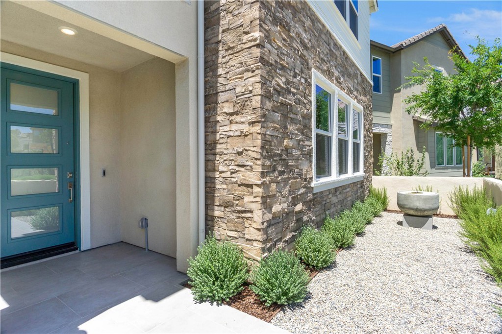 156 Chorus Irvine, CA 92618 - Photo 4 of 45 front view of a house with a yard
