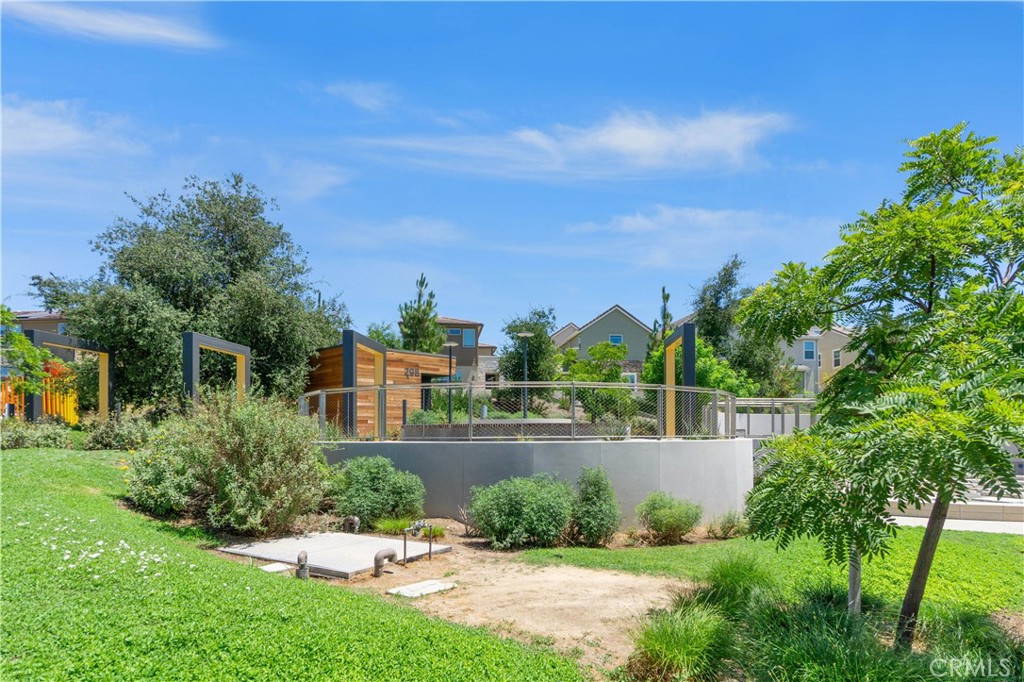 156 Chorus Irvine, CA 92618 - Photo 44 of 45 a view of a garden with a building in the background