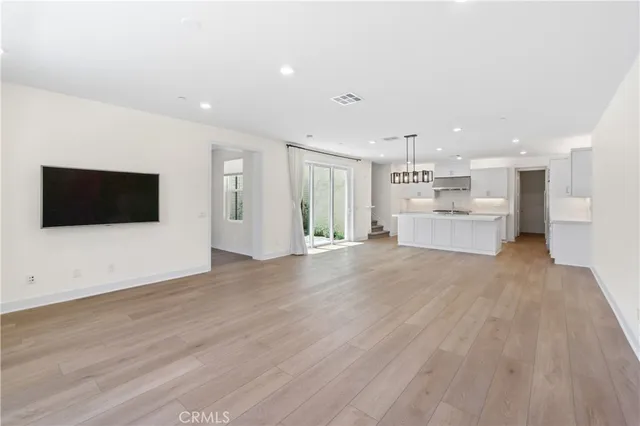 a view of a kitchen with a sink and a microwave
