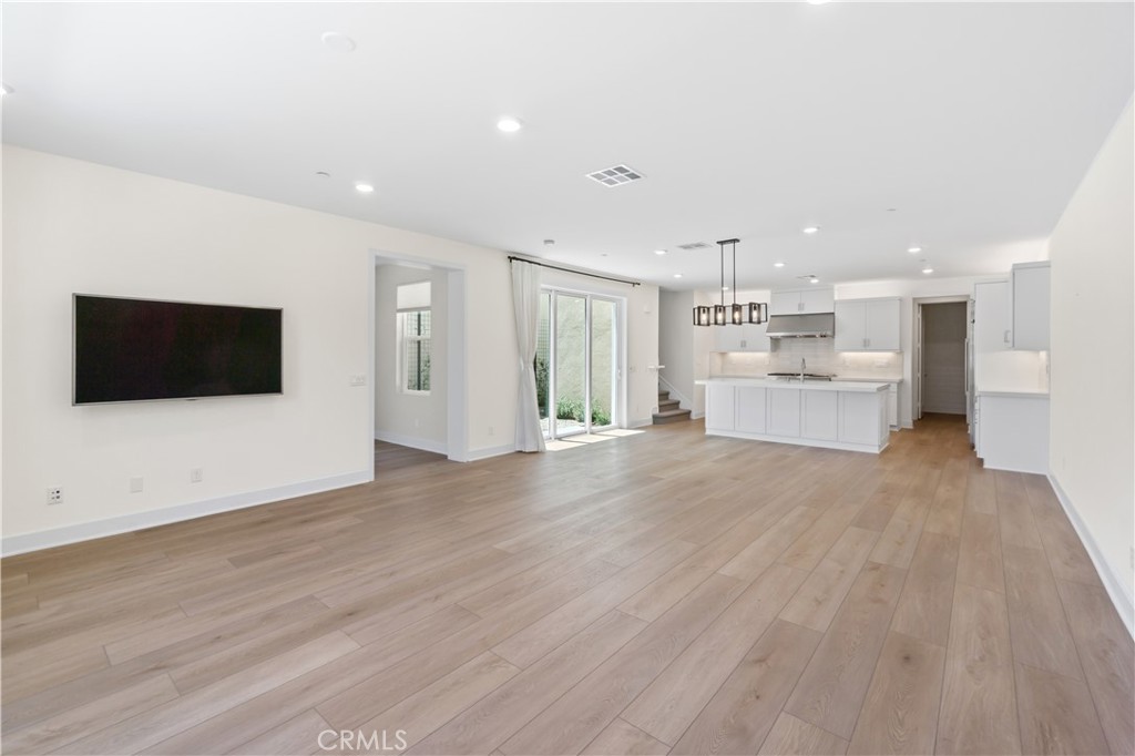 156 Chorus Irvine, CA 92618 - Photo 7 of 45 a view of a kitchen with a sink and a microwave