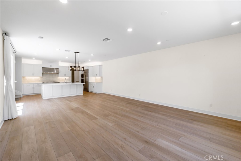 156 Chorus Irvine, CA 92618 - Photo 8 of 45 a view of a kitchen with a sink and a stove top oven