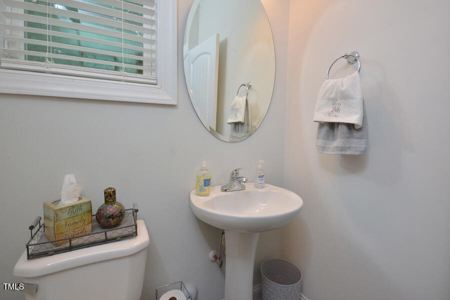 195 Timberwind Road Franklinton, NC 27525 - Photo 6 of 28 a bathroom with a sink and a mirror