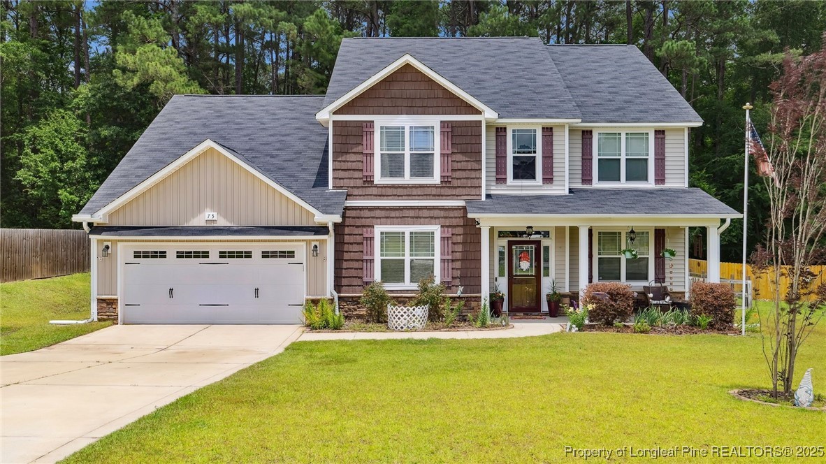 a front view of a house with yard porch and furniture