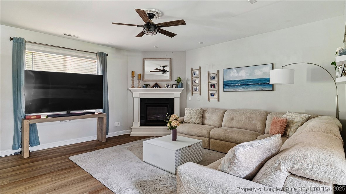 75 Bynum Court Carthage, NC 28327 - Photo 11 of 49 a living room with furniture and a flat screen tv