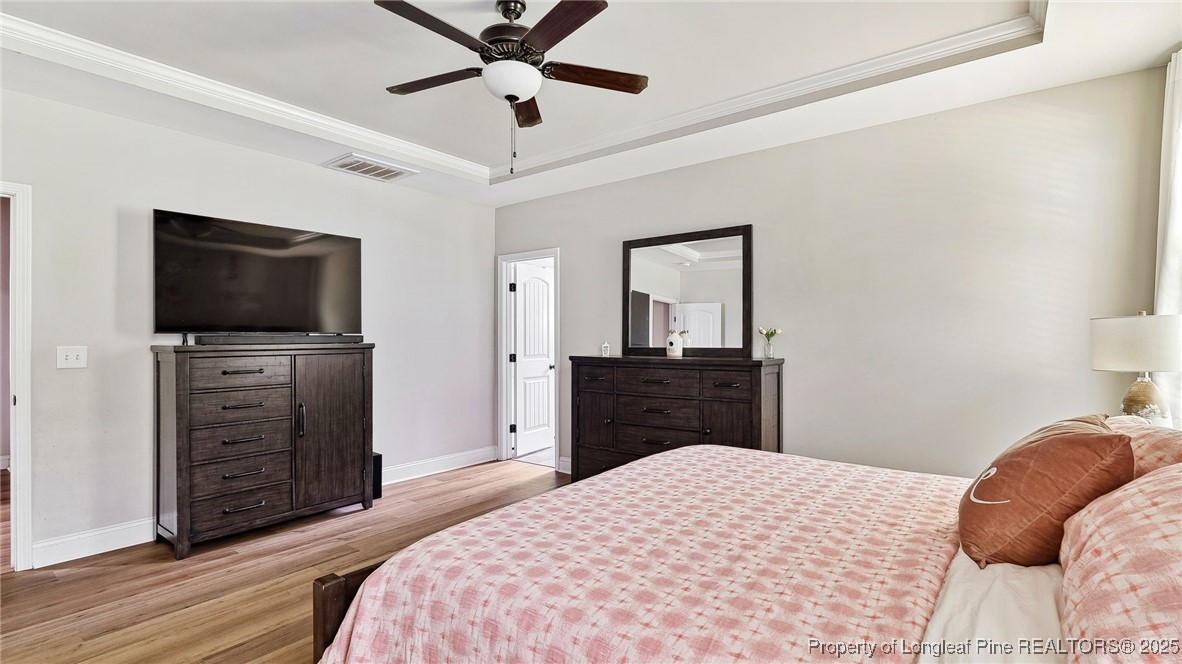 75 Bynum Court Carthage, NC 28327 - Photo 21 of 49 a bedroom with a bed and a flat screen tv