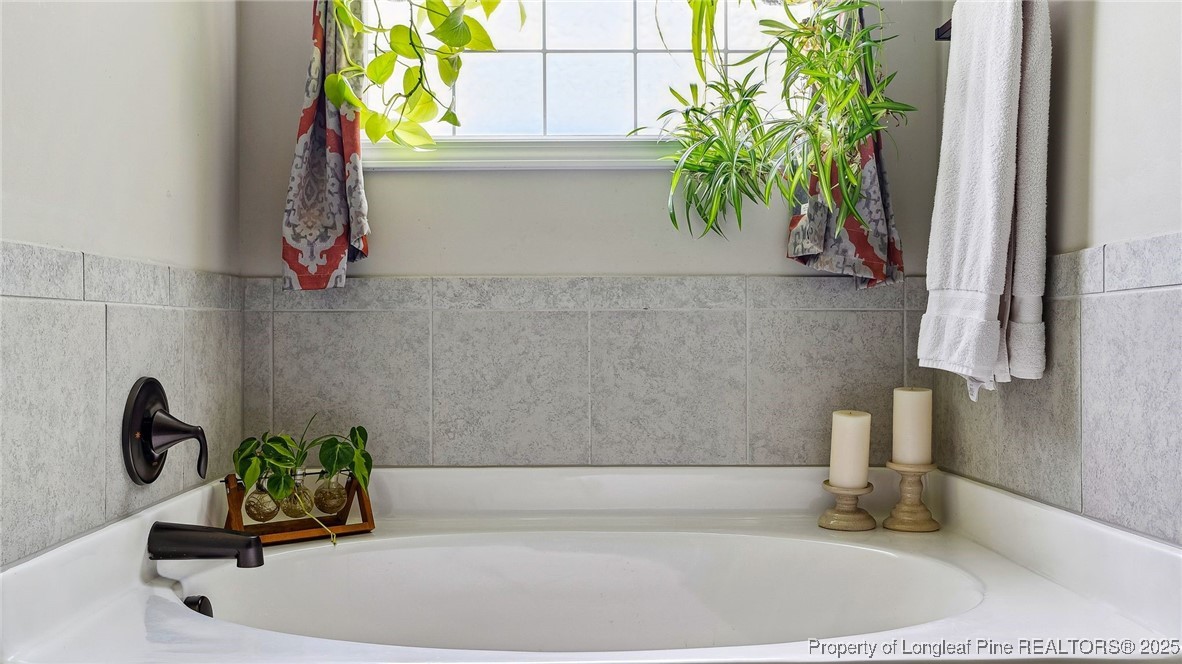 75 Bynum Court Carthage, NC 28327 - Photo 22 of 49 a bathroom with a tub