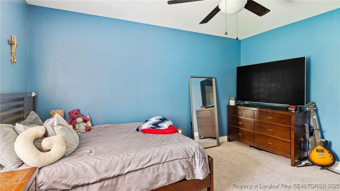 75 Bynum Court Carthage, NC 28327 - Photo 25 of 49 a bedroom with a bed and flat screen tv