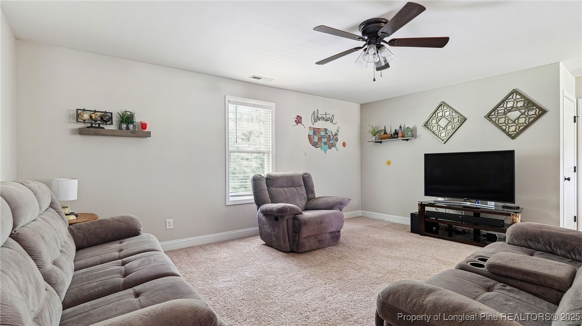 75 Bynum Court Carthage, NC 28327 - Photo 31 of 49 a living room with furniture and a flat screen tv