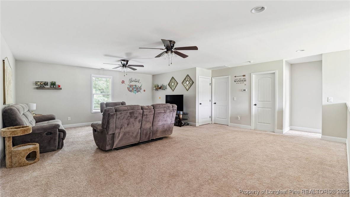 75 Bynum Court Carthage, NC 28327 - Photo 33 of 49 a living room with furniture and a ceiling fan