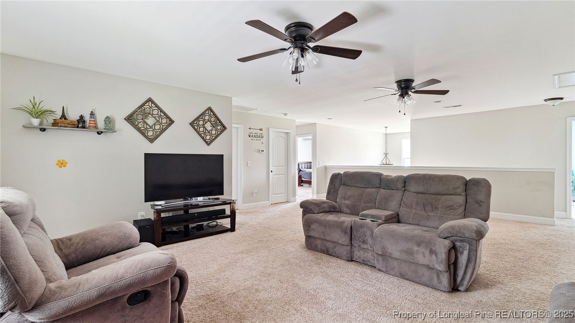 75 Bynum Court Carthage, NC 28327 - Photo 34 of 49 a living room with furniture and a flat screen tv