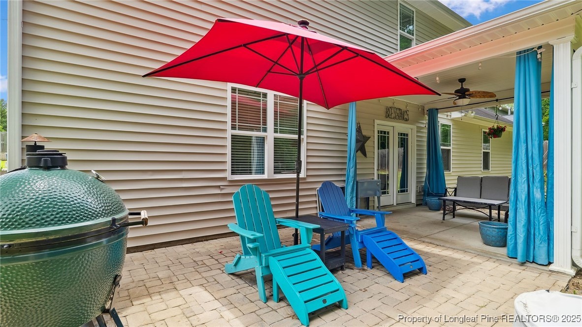 75 Bynum Court Carthage, NC 28327 - Photo 42 of 49 a patio with tables and chairs