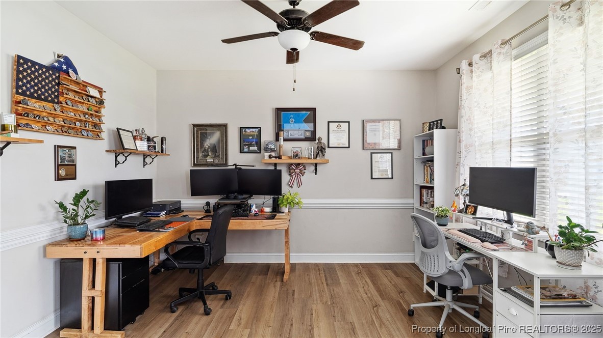 75 Bynum Court Carthage, NC 28327 - Photo 8 of 49 a workspace with furniture and wooden floor