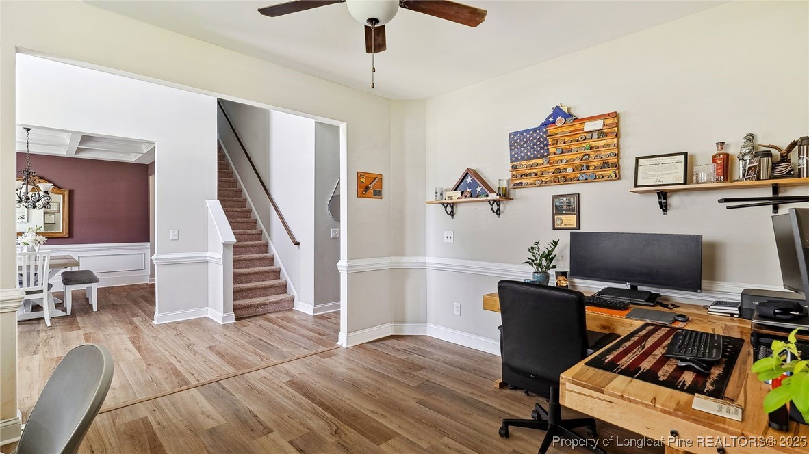75 Bynum Court Carthage, NC 28327 - Photo 9 of 49 a view of a workspace with furniture and staircase