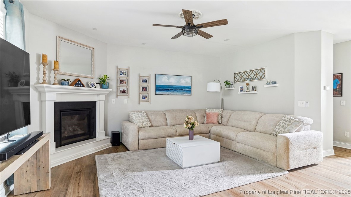 75 Bynum Court Carthage, NC 28327 - Photo 10 of 49 a living room with furniture a window and a fireplace