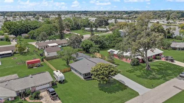an aerial view of a house with a garden
